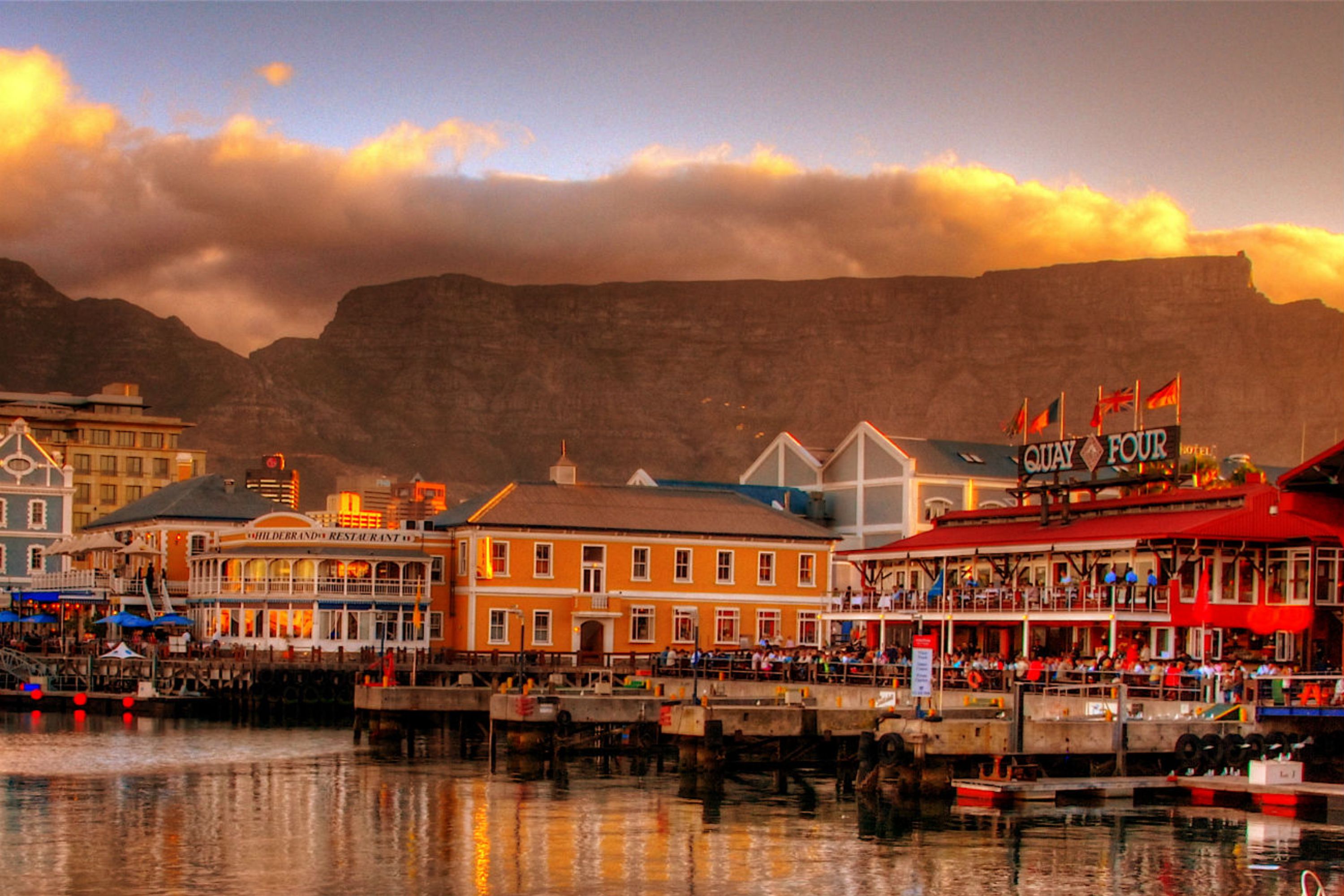 Colourful buildings on the waterfront in Cape Town, South Africa, with Table Mountain behind