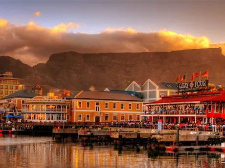 Colourful buildings on the waterfront in Cape Town, South Africa, with Table Mountain behind