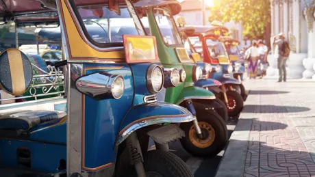 Jinrikishas lined up on street