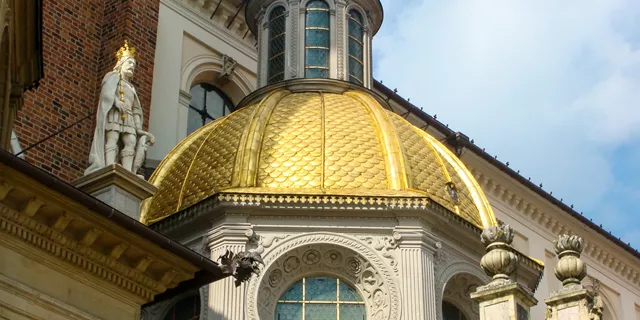A gold dome on top of a St Johns Cathedral in Warsaw