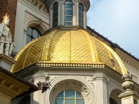A gold dome on top of a St Johns Cathedral in Warsaw