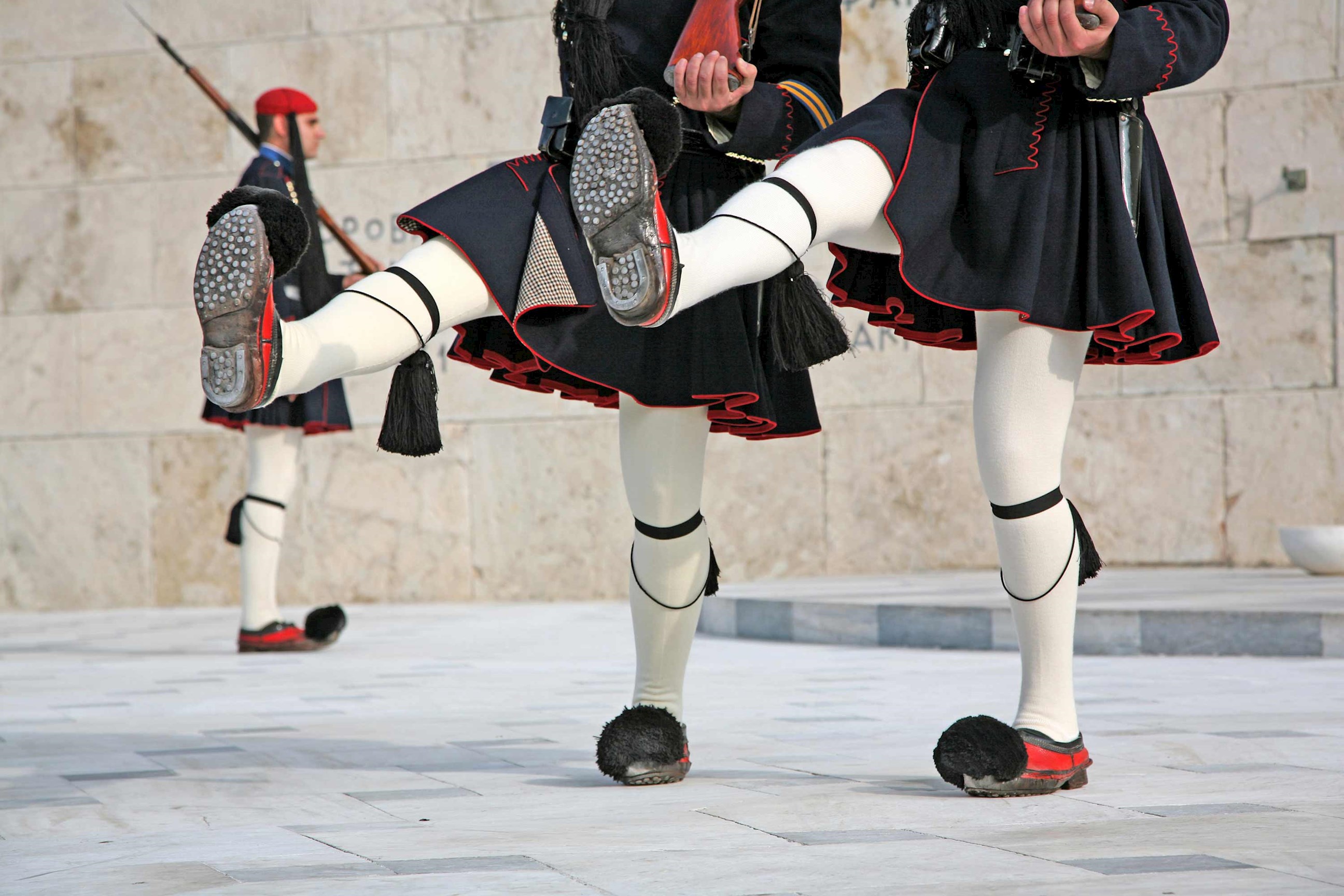 Close-up of Evzones guards’ traditional uniform during ceremonial march