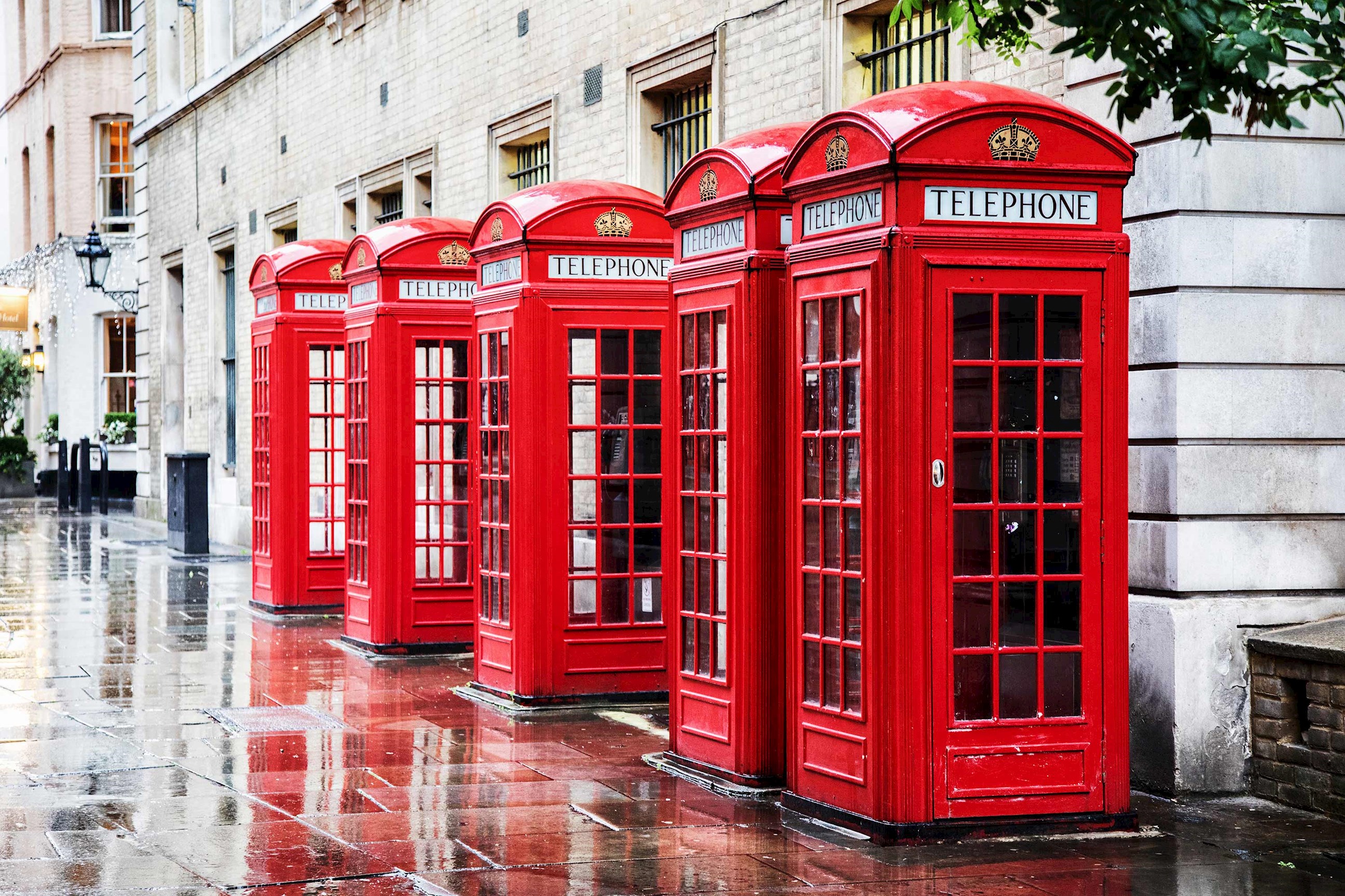 A row of classic telephone boxes in London, England