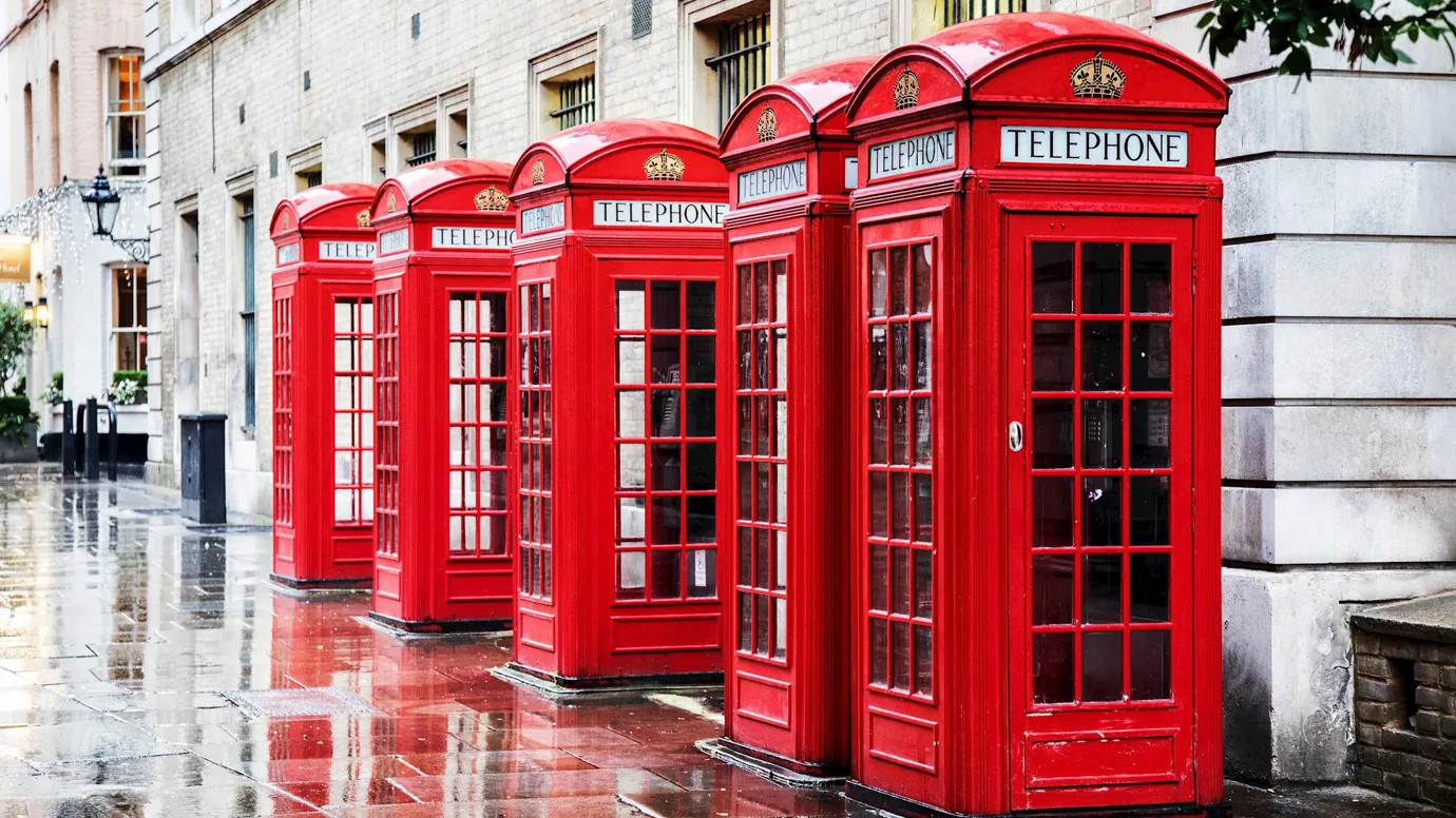 A row of classic telephone boxes in London, England