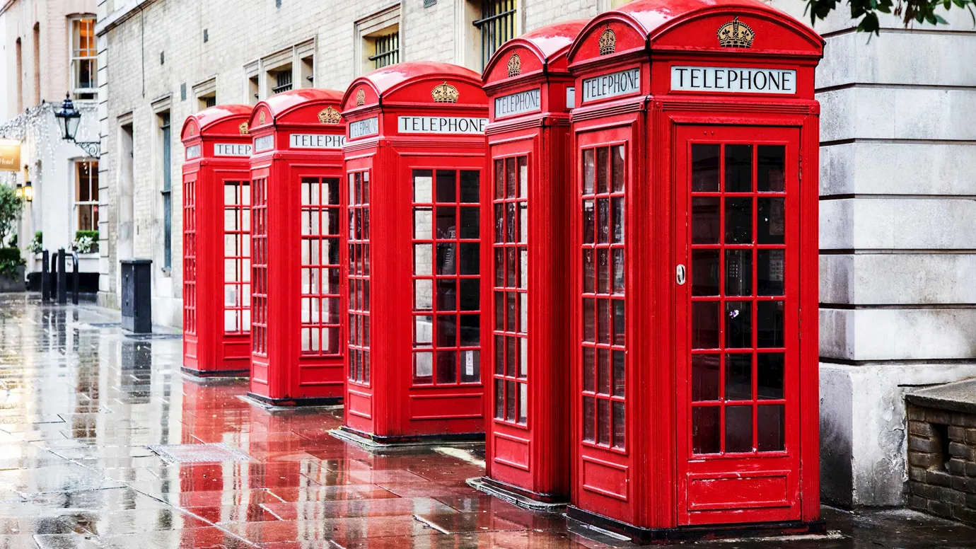 A row of classic telephone boxes in London, England