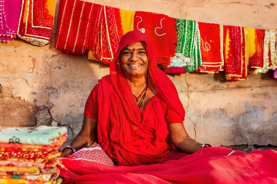 Indian lady selling fabrics