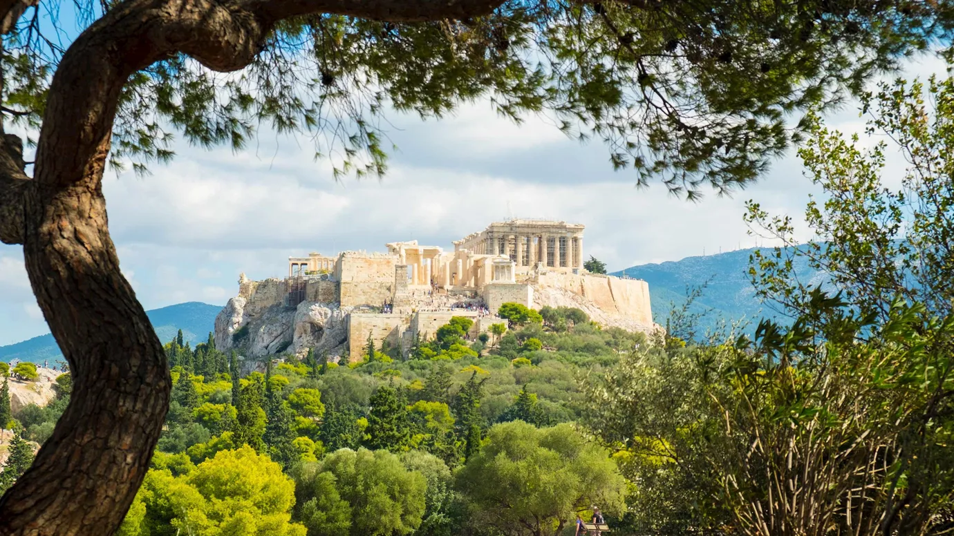 Historic structure overlooking a landscape with mountains in Athens, Greece