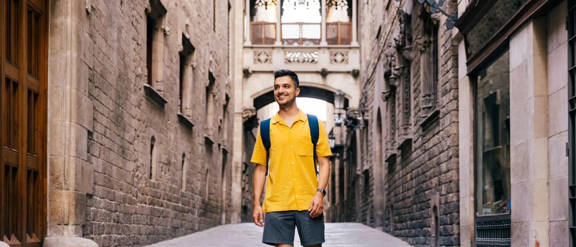 Man walking in the streets of Gothic Quarter in Barcelona, Spain