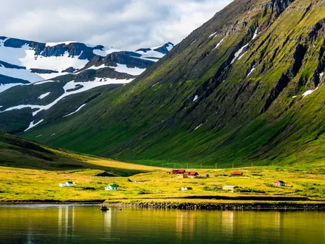 Scandinavia Fjord Village with green hills and mountains