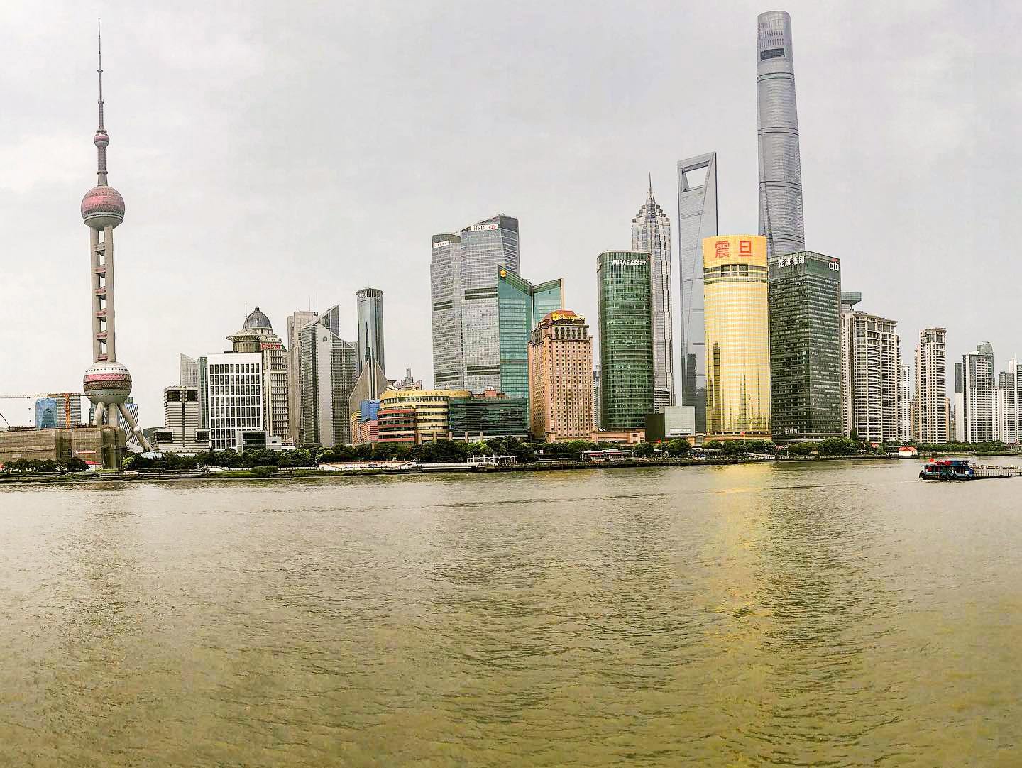 The skyline of Shanghai reflected in water, China