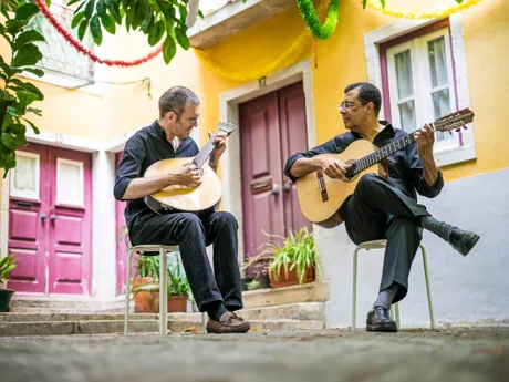 Two Fado Guitarists With Acoustic And Portuguese Guitars In Alfama Lisbon Portugal