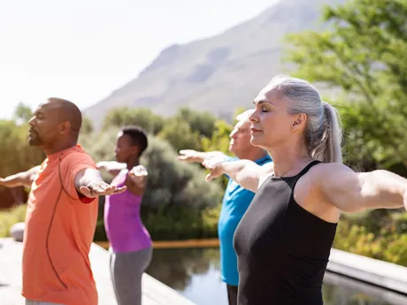 Three Cheerful Female Teenager Friends With Ice Cream Standing On The Street, Laughing