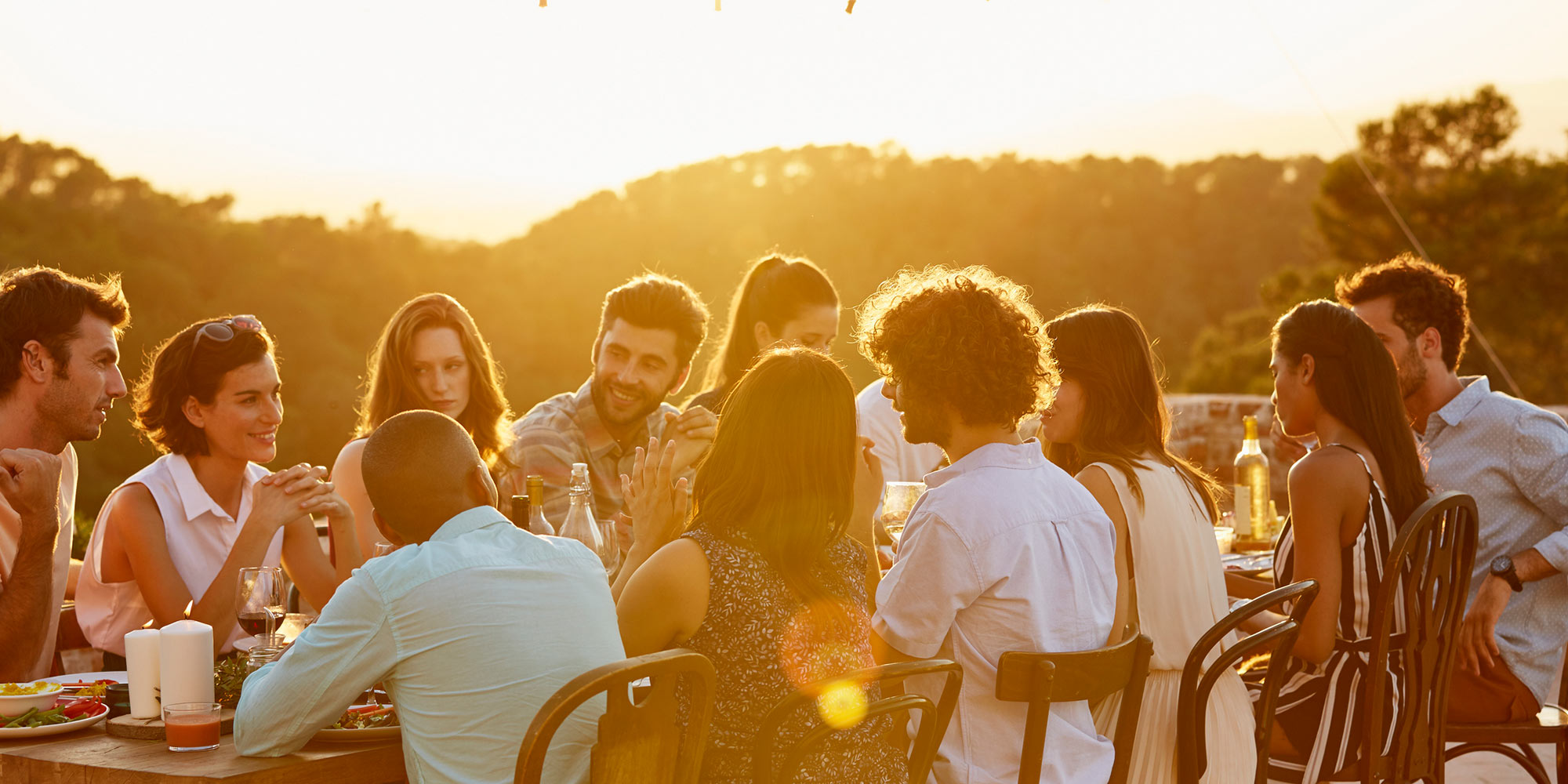 Tour group dining around an outside table