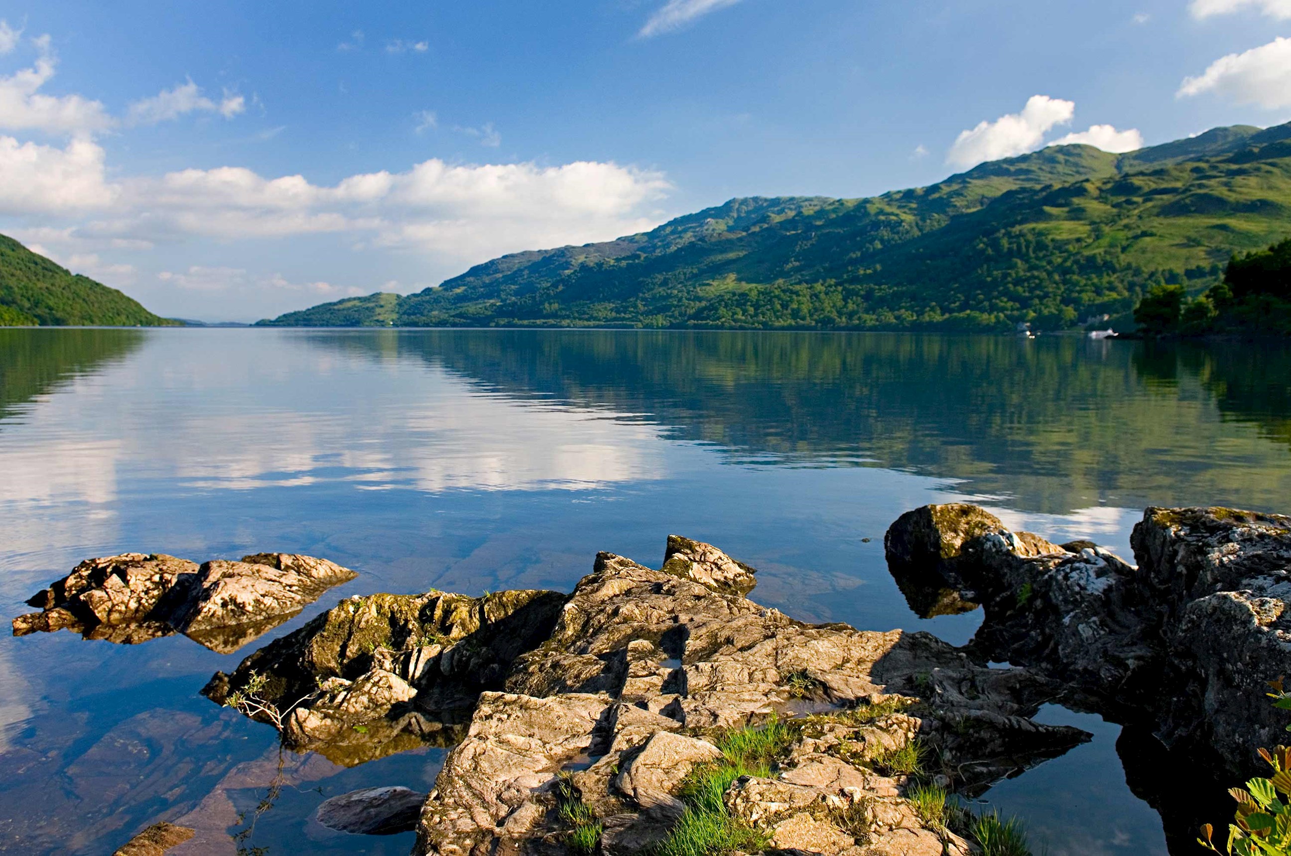 Landscape of Loch Lomond against clear skies in Scotland 