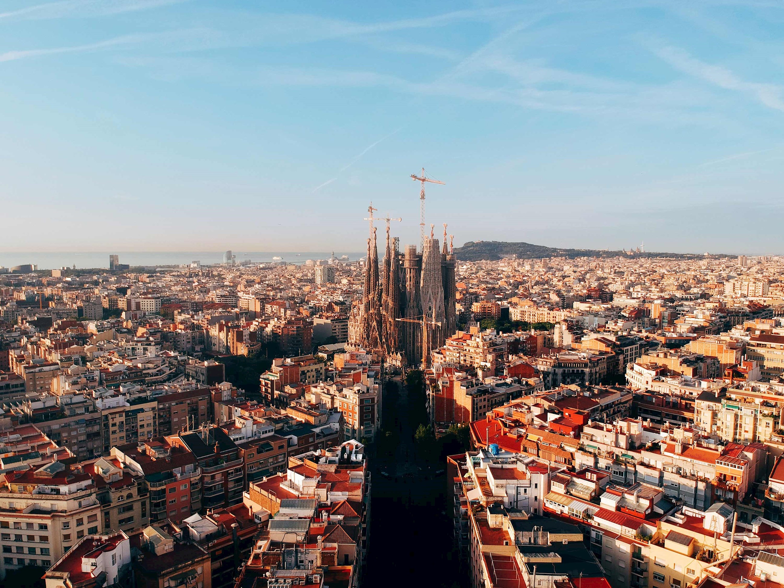 Aerial view of sprawling city against clear skies in Barcelona, Spain