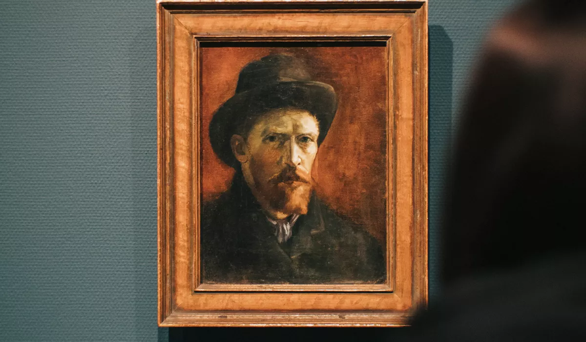 A painting of a man wearing a hat Van Gogh in Holland Amsterdam 