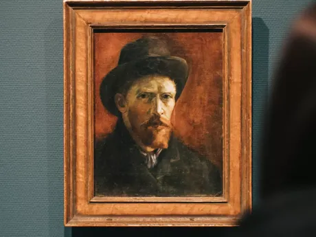 A painting of a man wearing a hat Van Gogh in Holland Amsterdam