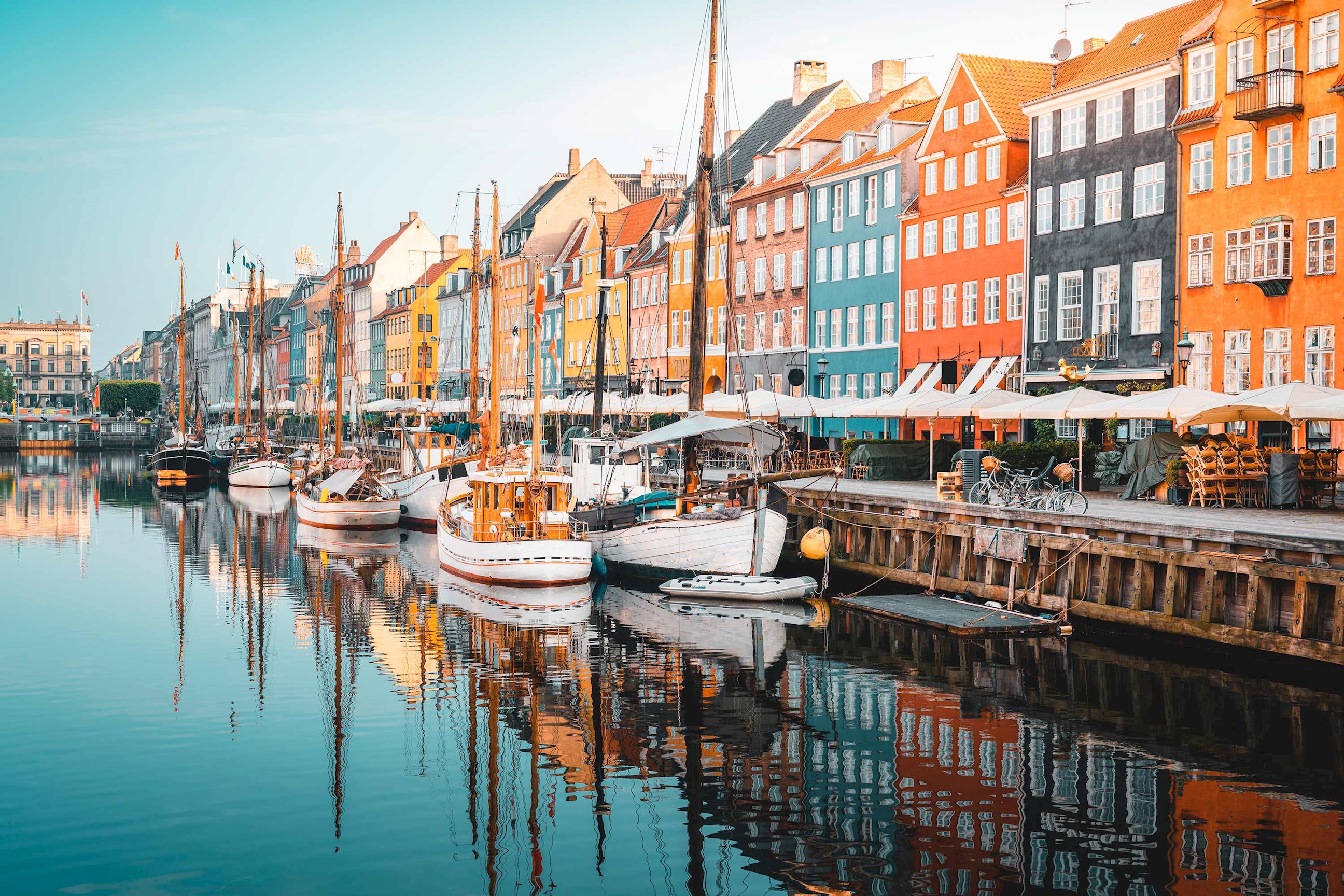 A scenic riverside view of boats in Copenhagen, Denmark
