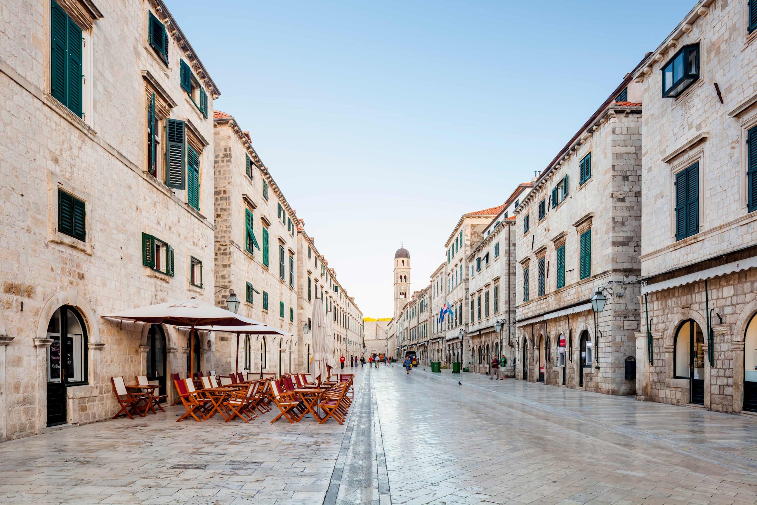 A stone-paved Stradun street with cafes in Dubrovnik, Croatia