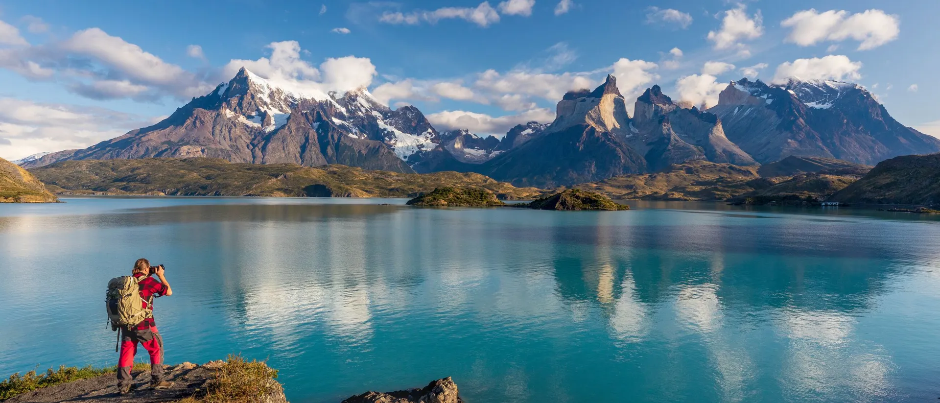 Man photographing Torres Del Paine At Lago Pehoe, Patagonia, Argentina