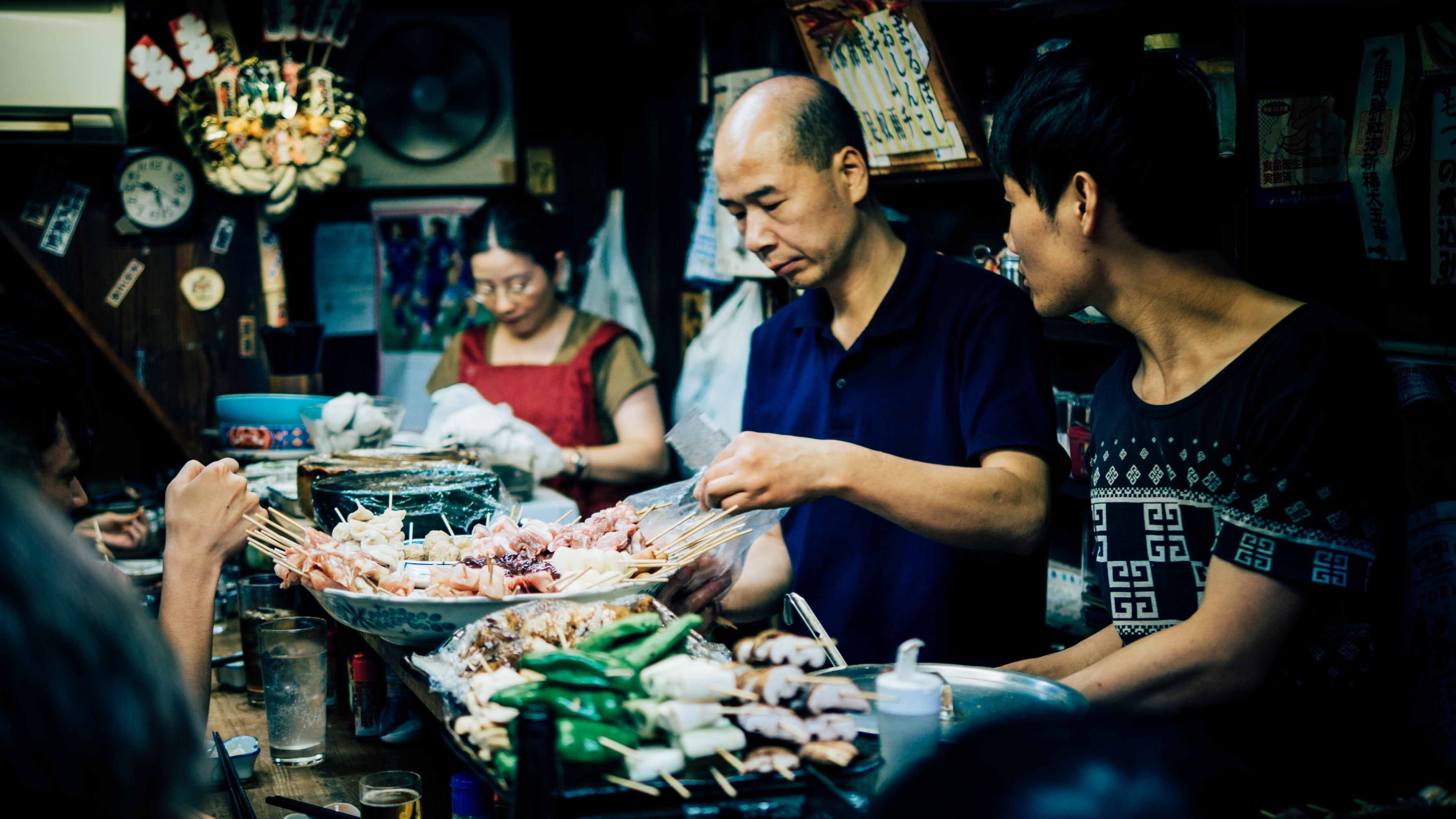 A market stall in Japan selling food on skewers