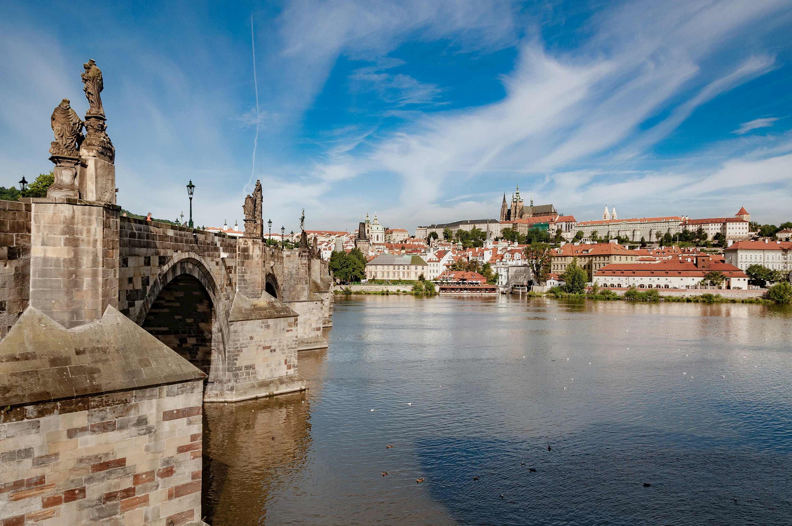 A scenic view of waterfront buildings in Prague, Czech Republic