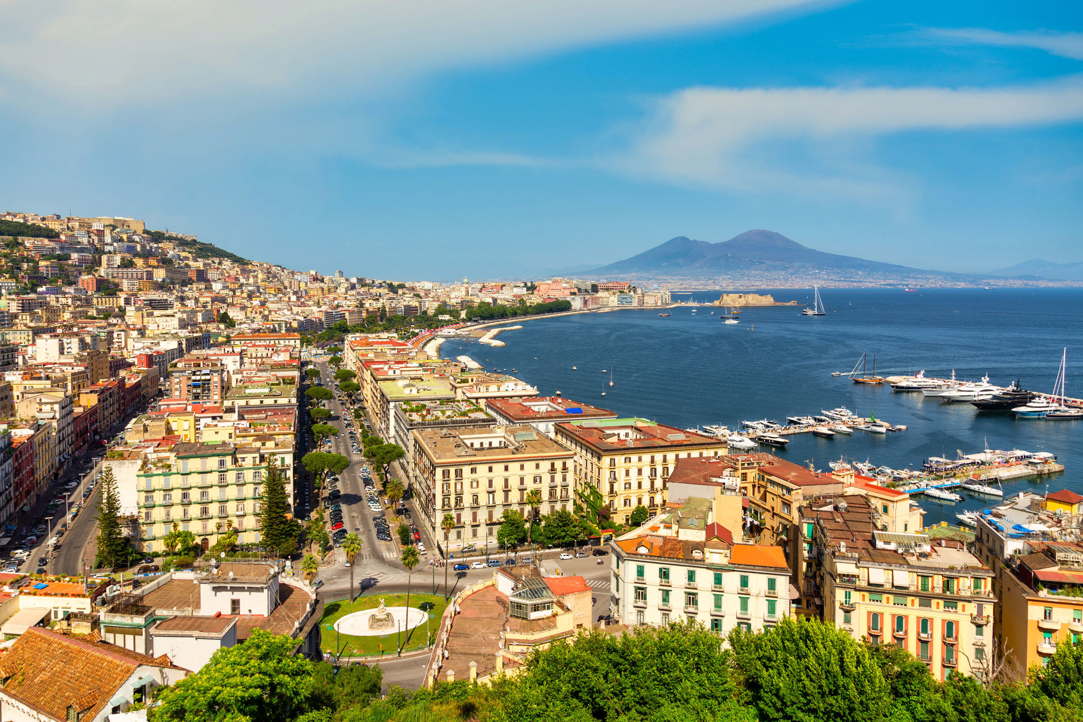 Panoramic view of a coastline with a mountain in the background in Naples, Italy