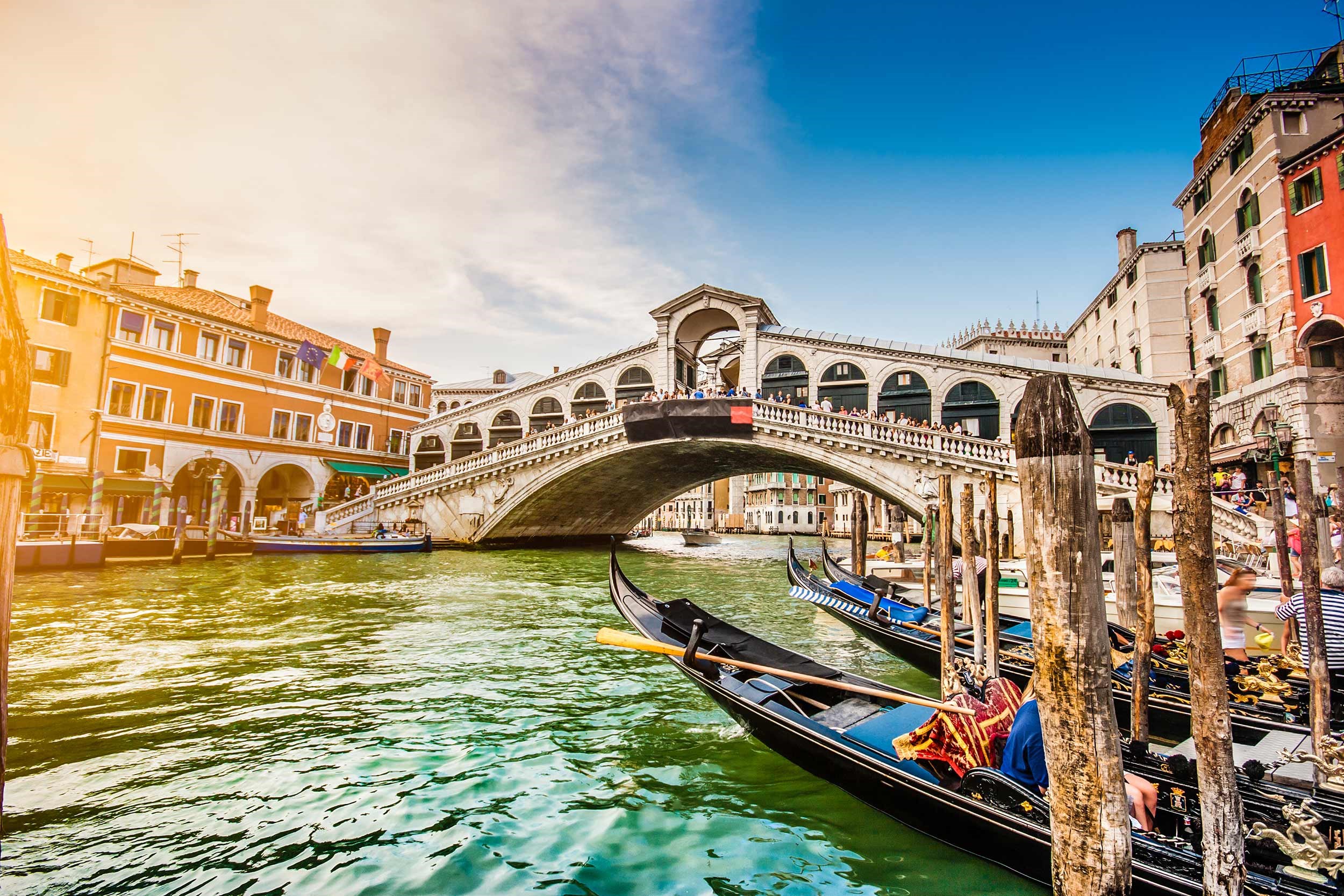 Canal Grande and Rialto Bridge in under clear skies in Venice, Italy