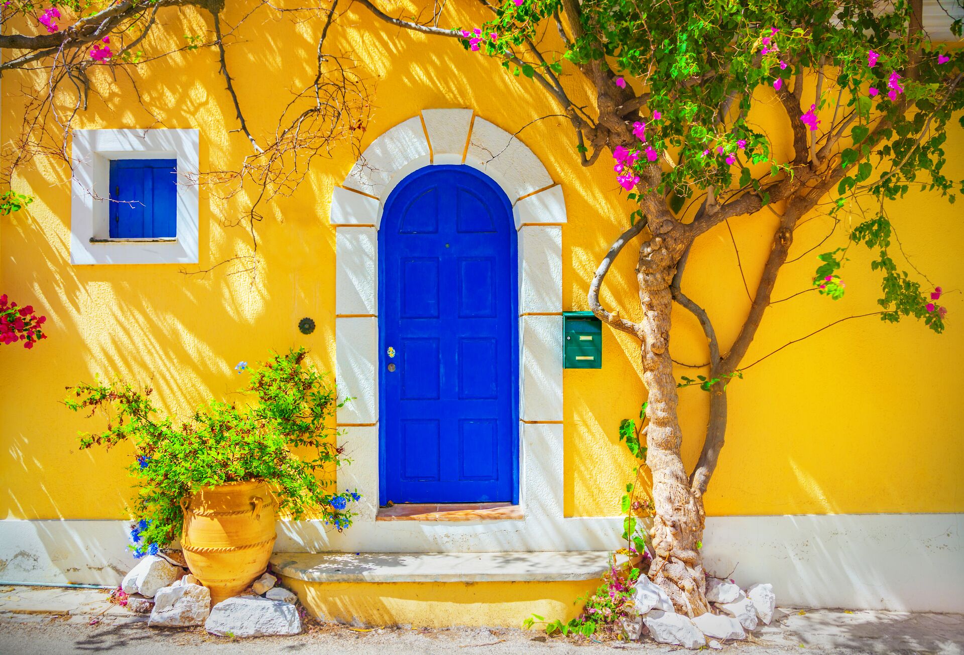 Blue door against a yellow building