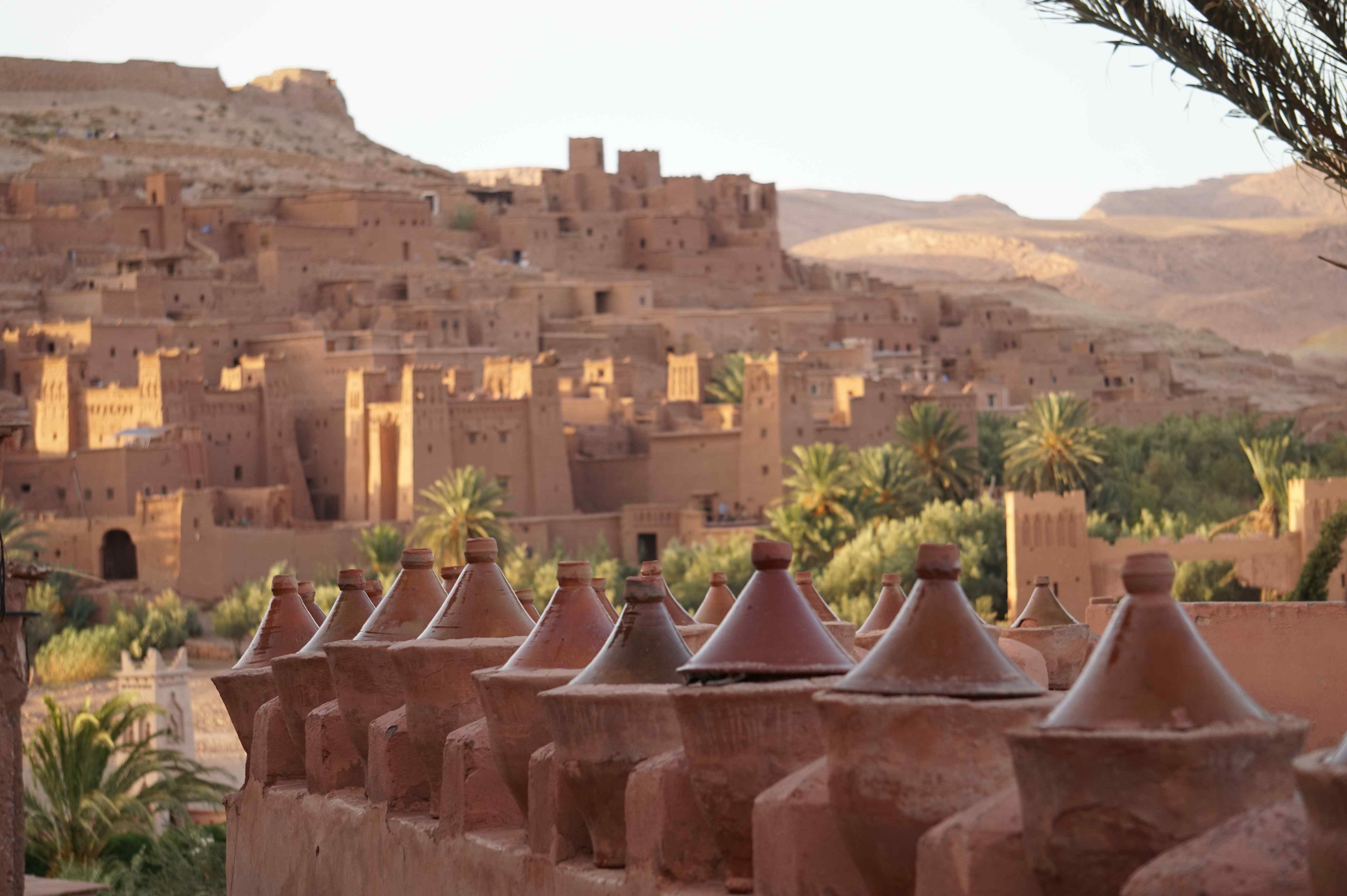 Traditional clay products in the foreground, Moroccan buildings in the background