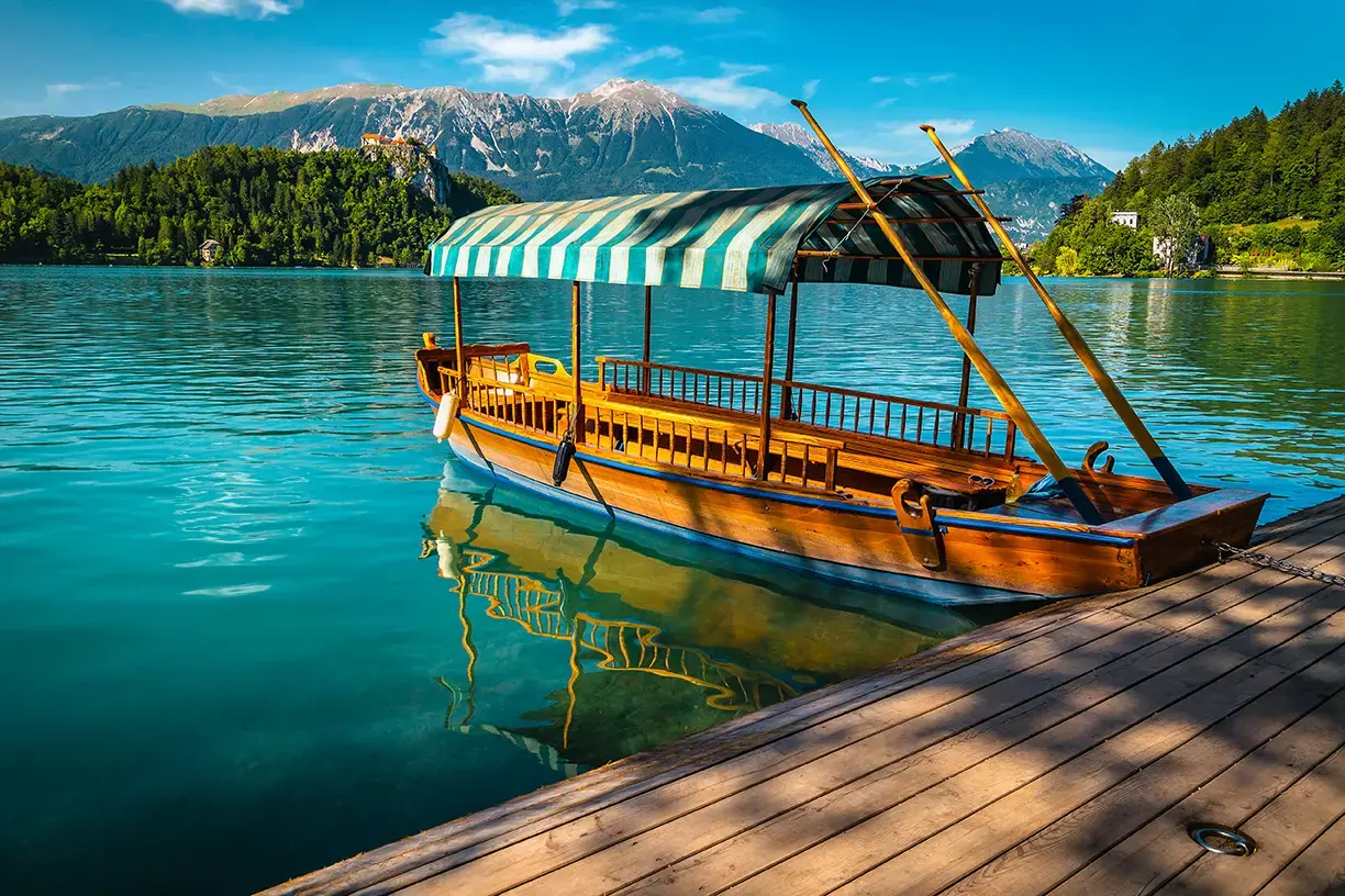 traditional-wooden-pletna-boat-moored-pier.webp