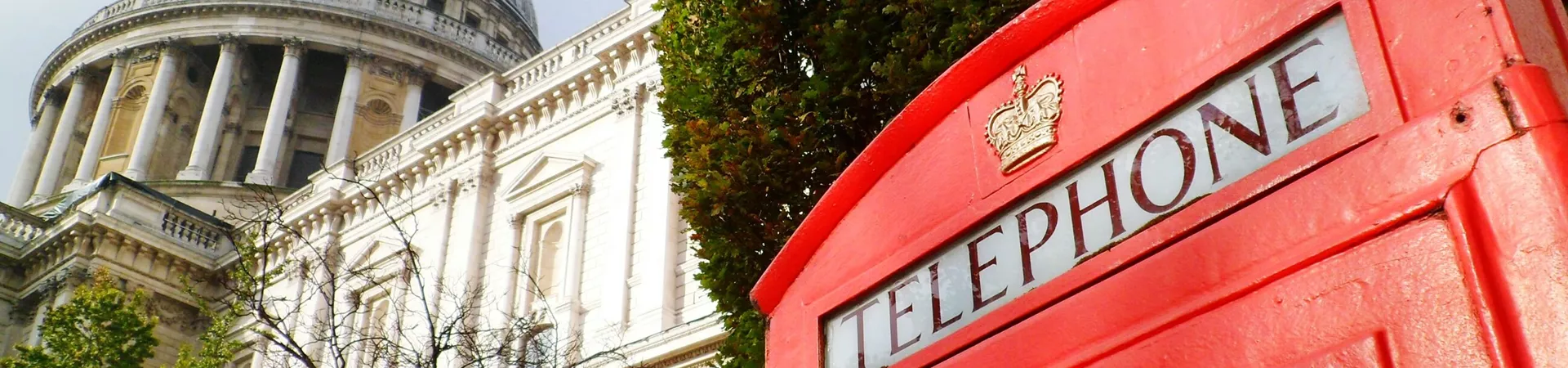Red telephone booth against St Paul Cathedral in London, United Kingdom