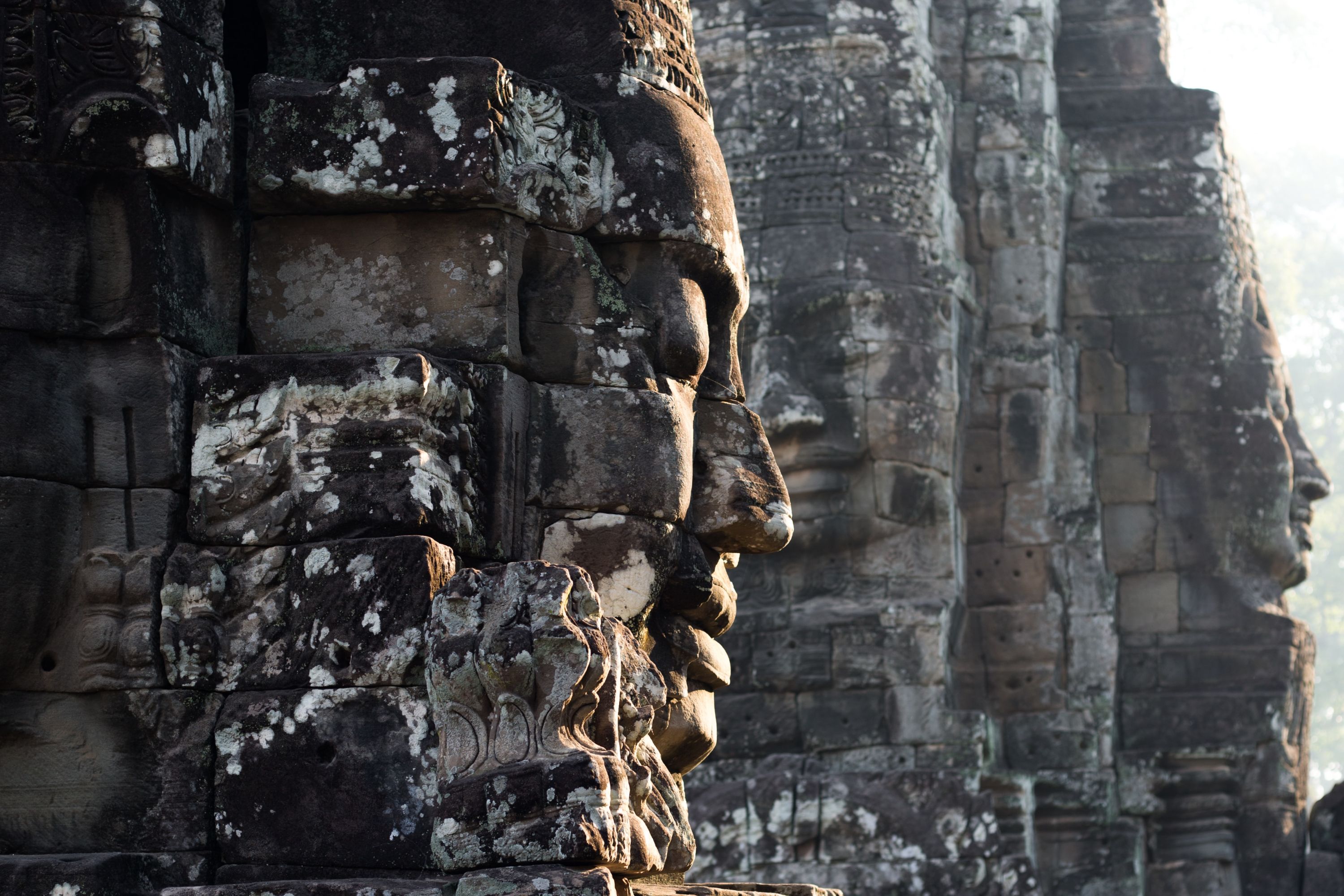 A face carved in stone showcasing the artistry of Khmer culture, Angkor Wat in Cambodia