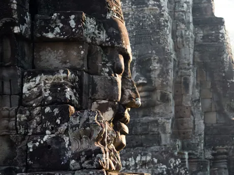 A face carved in stone showcasing the artistry of Khmer culture, Angkor Wat in Cambodia