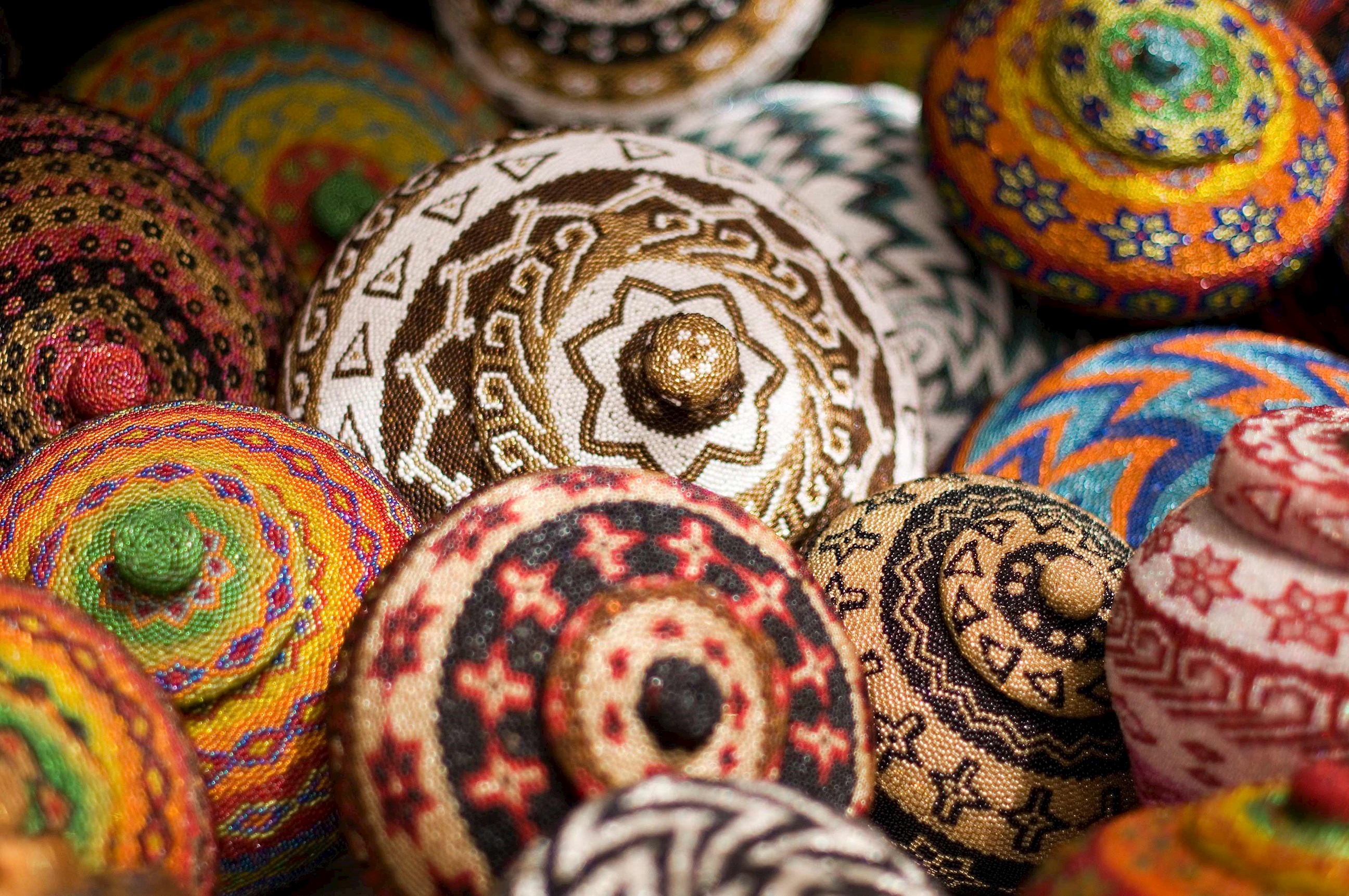 Close-up of colourful baskets made from beads 