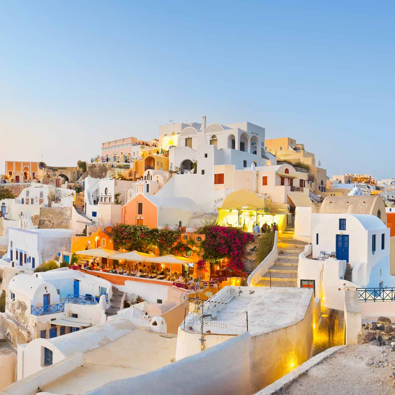 A view of a city with white buildings in Santorini, Greece