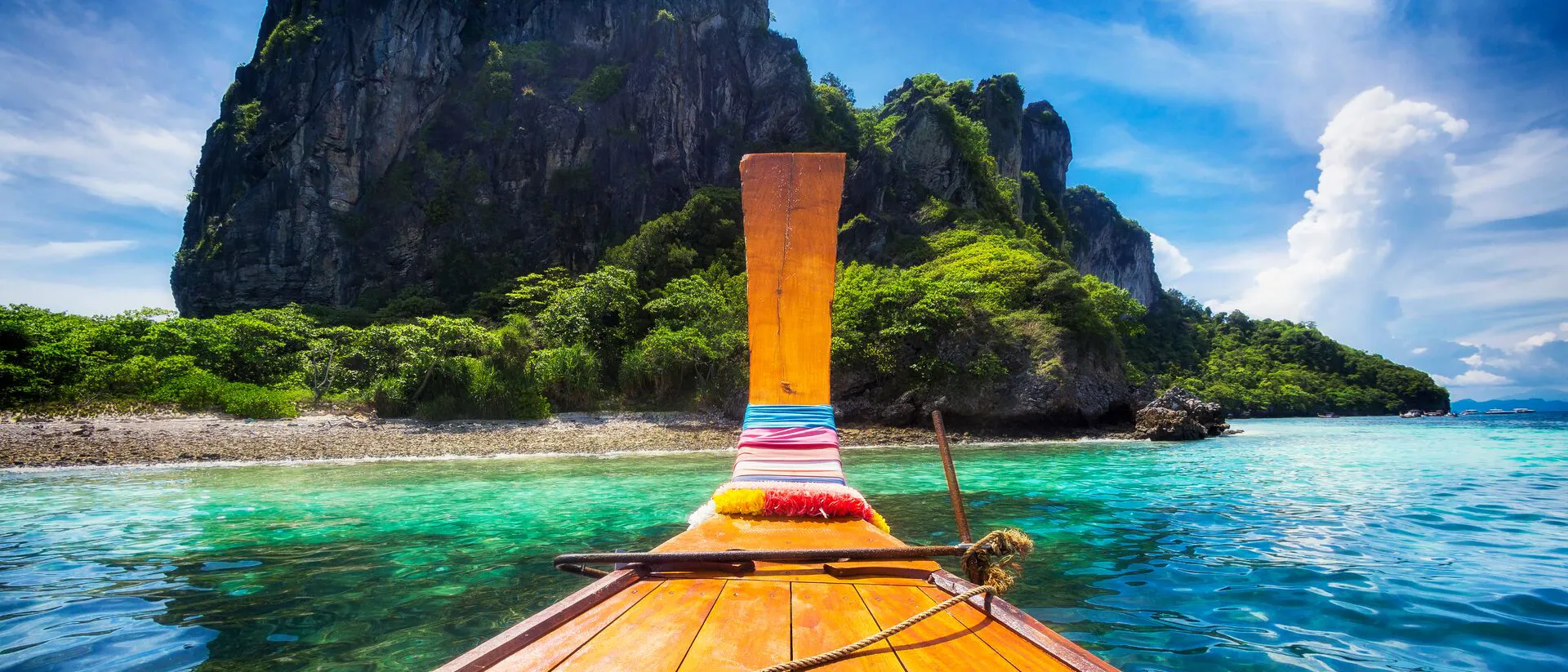 Long Tail Boat sailing towards Maya Bay in Koh Phi Phi, Thailand