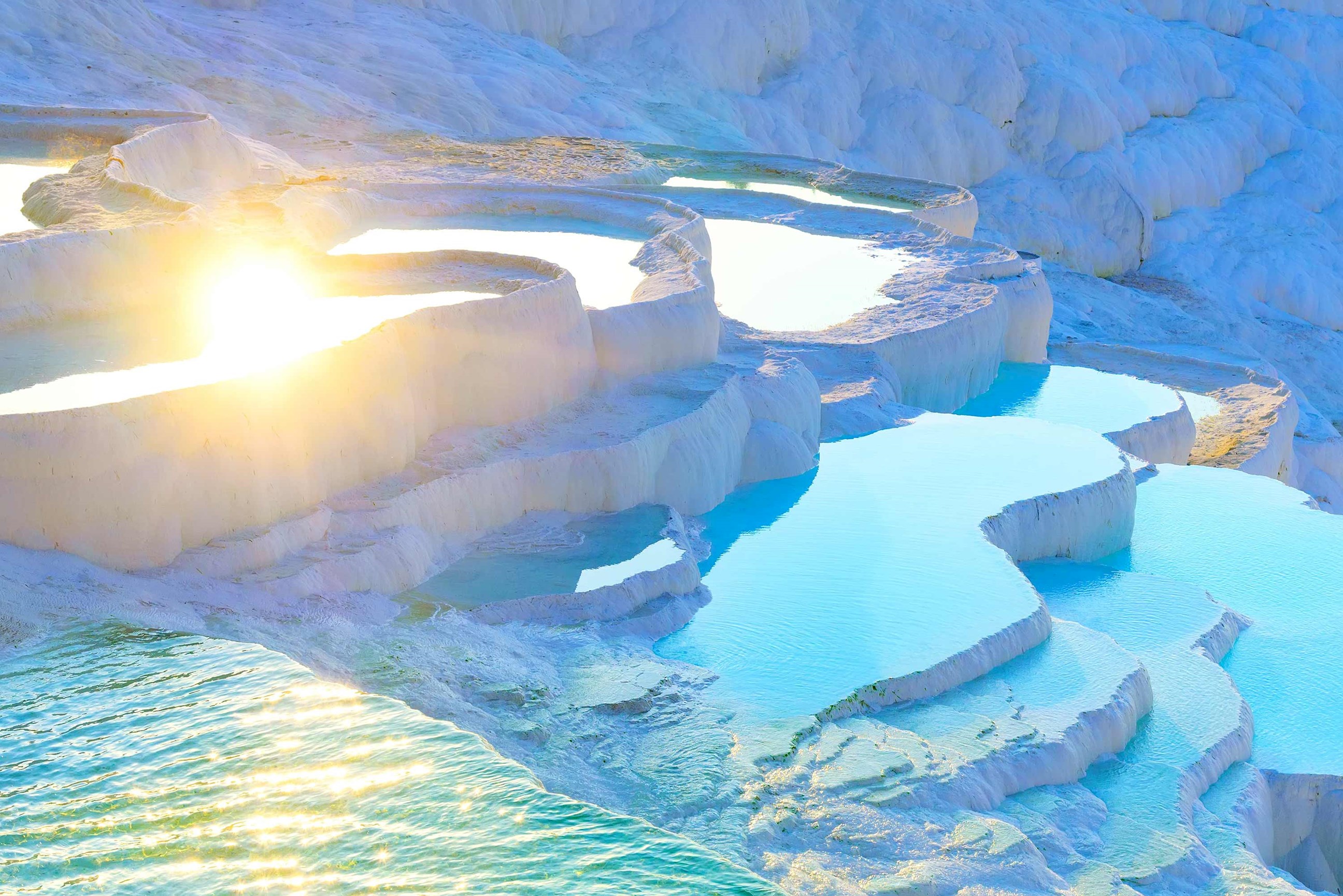 Pamukkale’s travertine terraces with turquoise thermal pools in Turkey