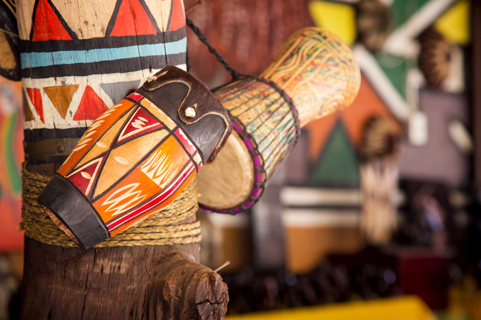 African drums on painted wooden stand