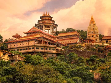 Vibrant ancient temple under the afternoon sun in Penang, Malaysia