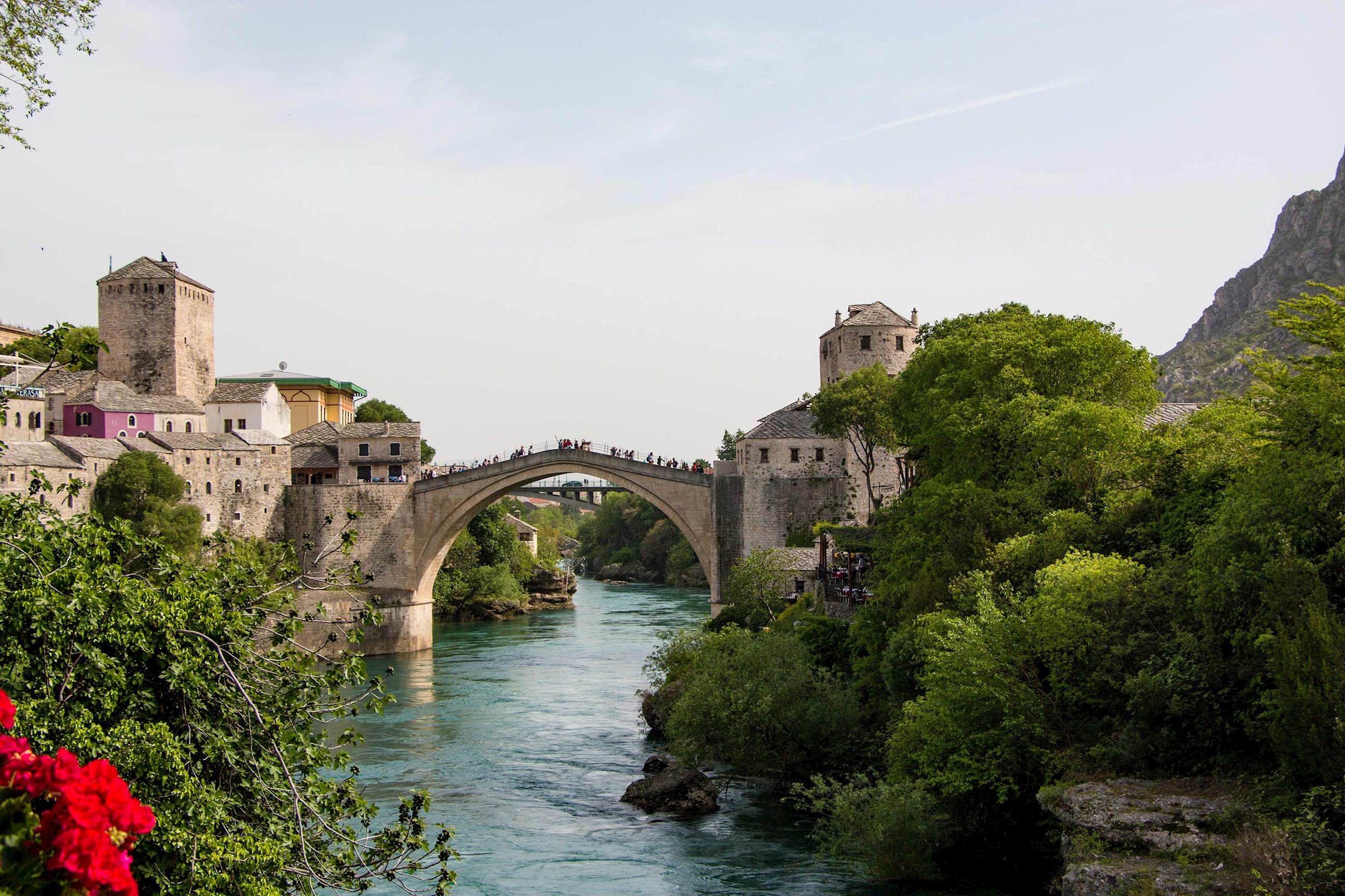 A stone arch bridge over a river in Mostar, Bosnia and Herzegovina