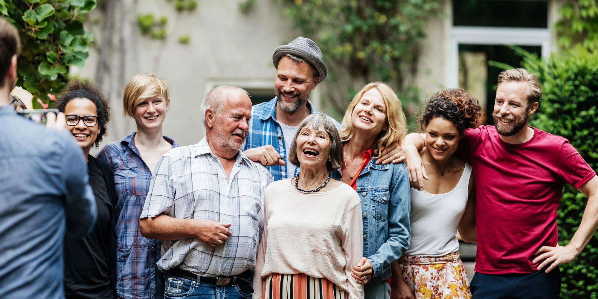 Happy family stood as they have their photo taken