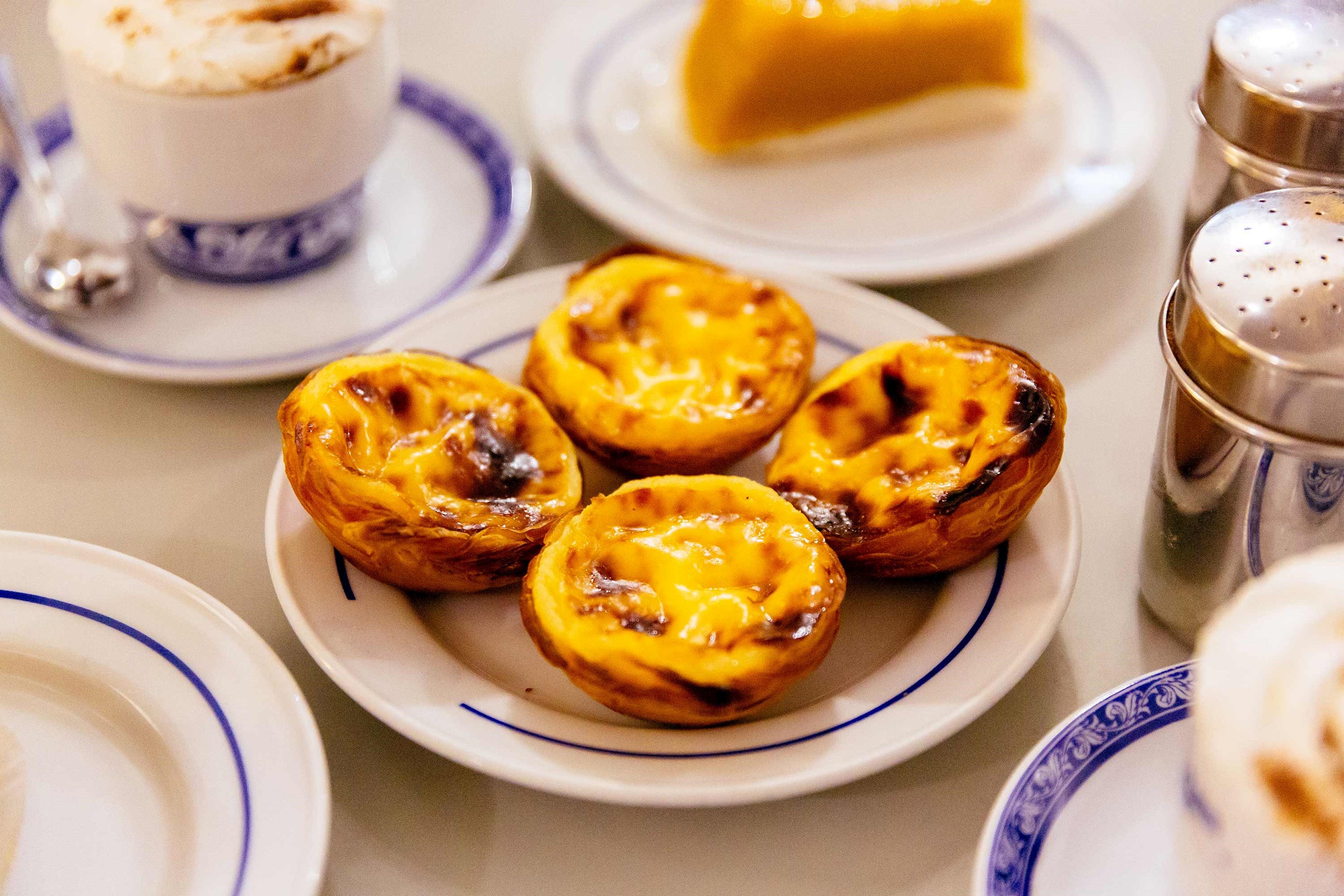 Plate of pastry served with coffee in Lisbon, Portugal