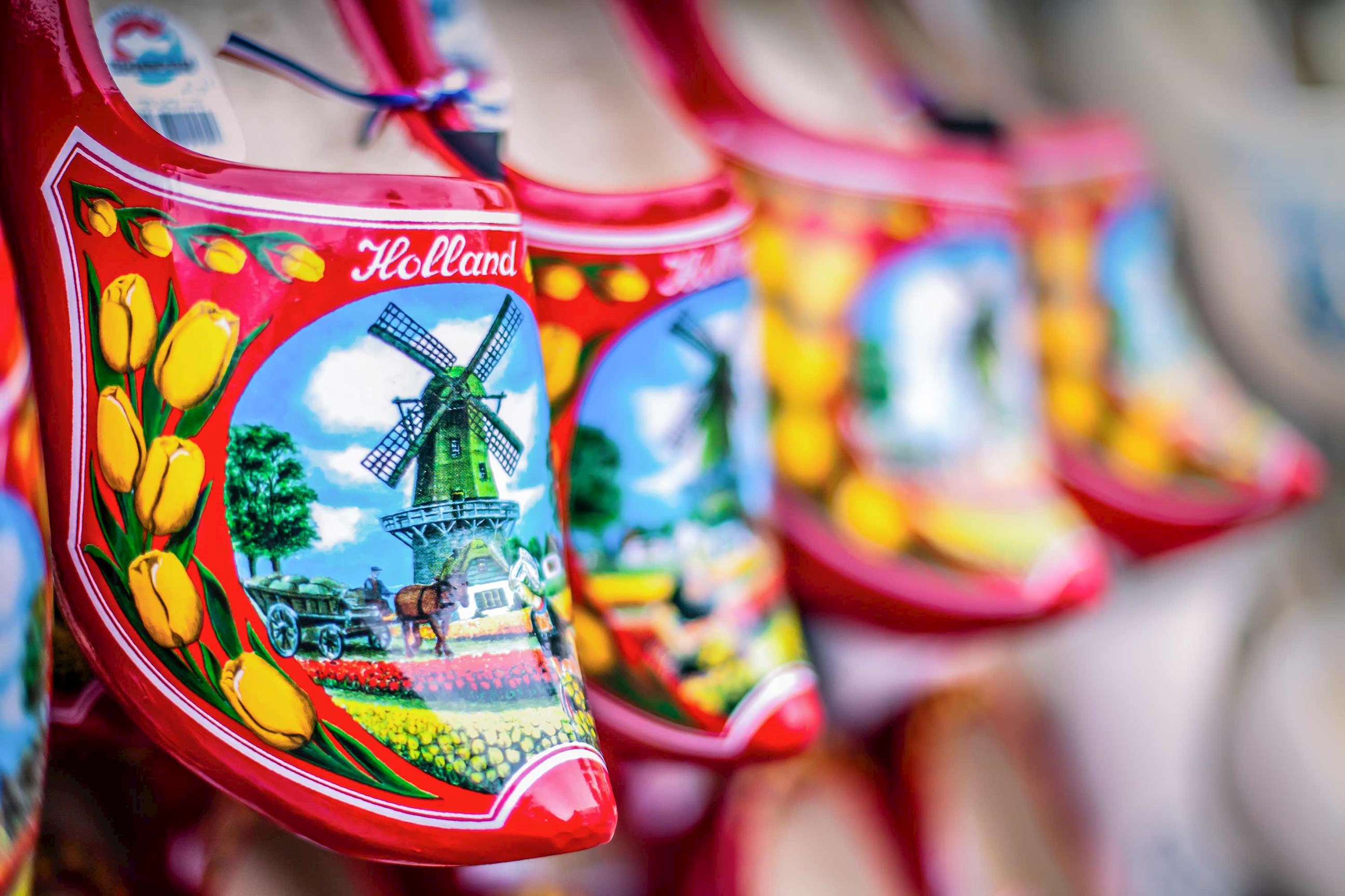 Brightly painted wooden clogs with windmill and tulip design