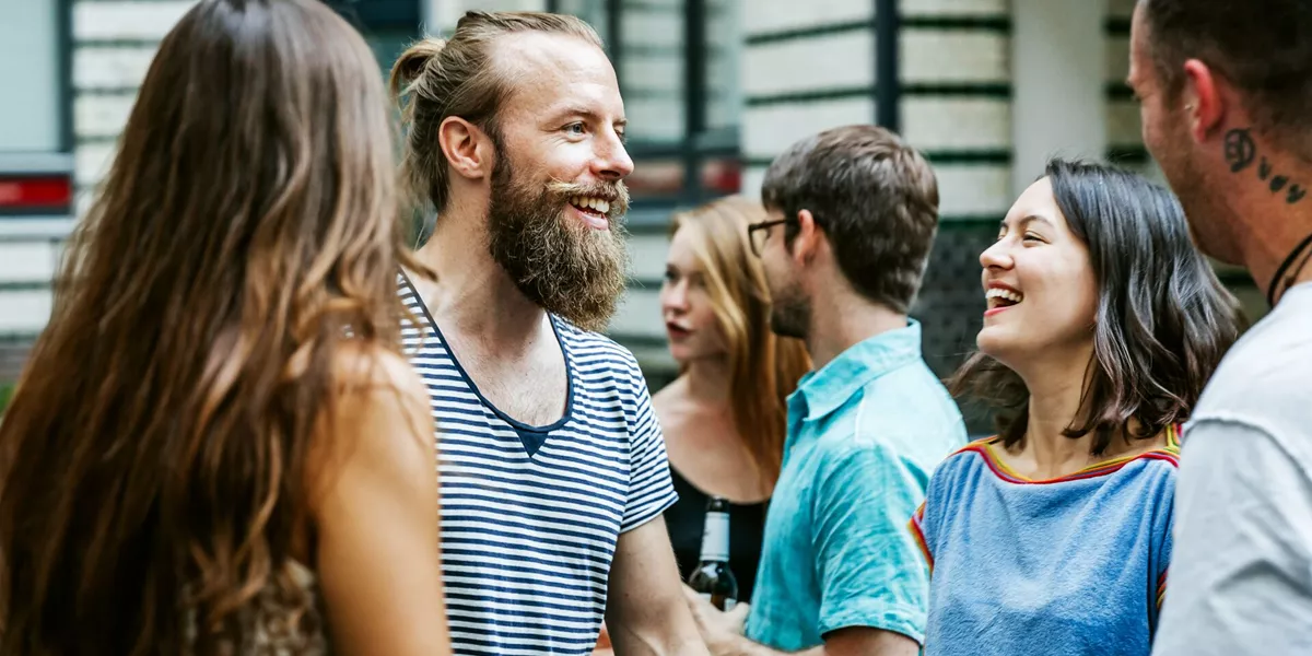 A Group Of Friends Meeting Together At Barbecue