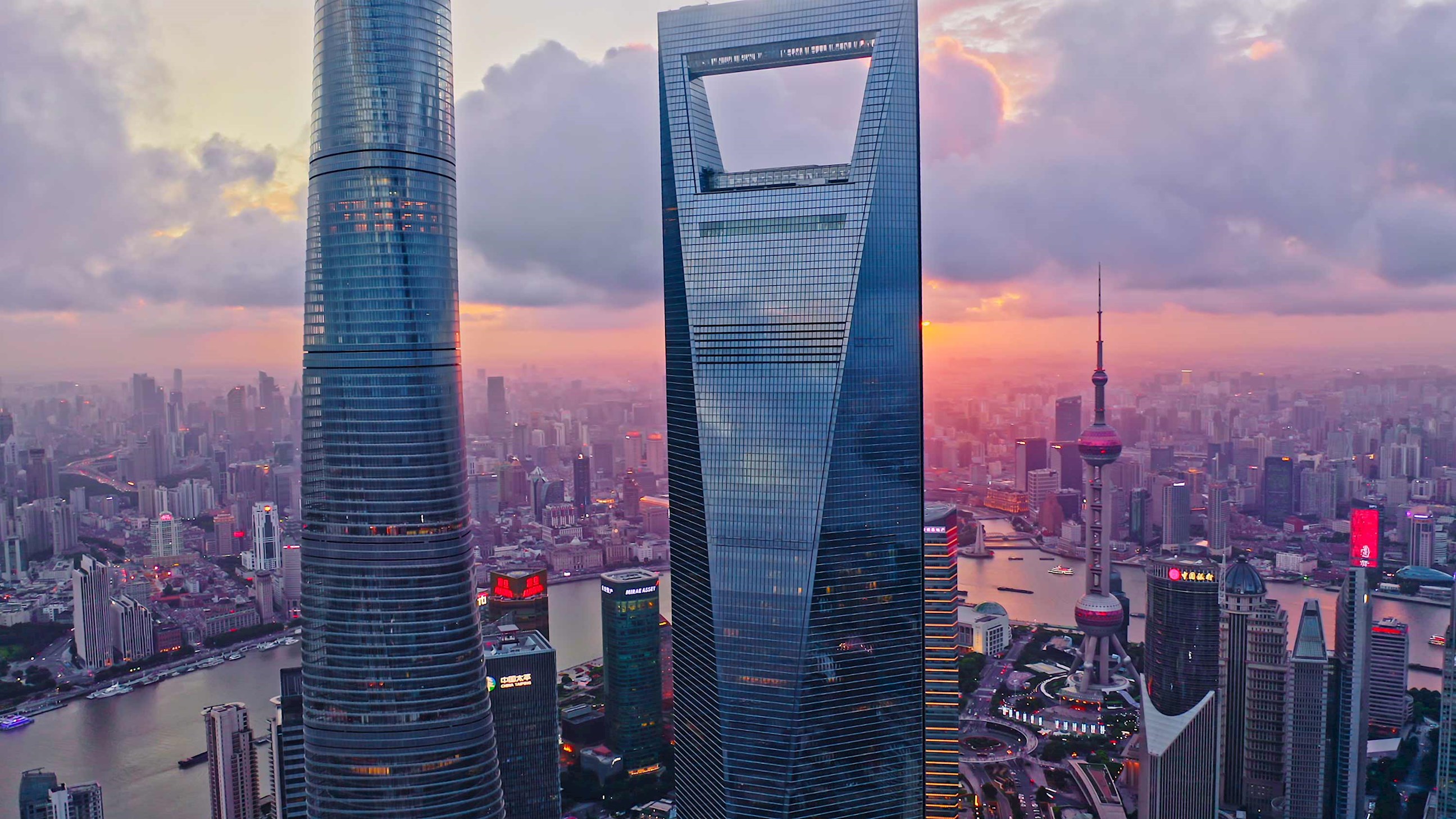 Jinmao Tower and Shanghai skyline against sunset sky, China