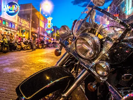 Bike on a night street with neons