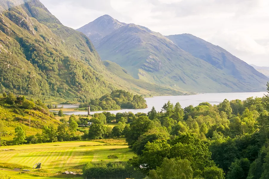 A scenic view of mountains and a lake