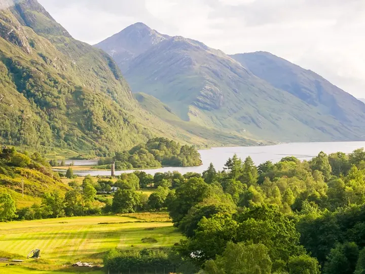 A scenic view of mountains and a lake