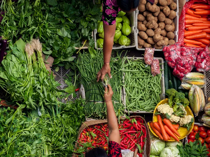 Crates of potatoes, vegetables and chilies on a food market in Bali, Indonesia